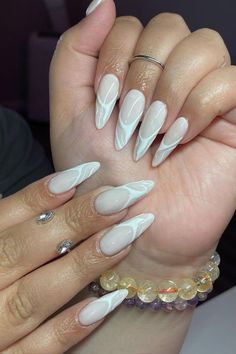 Opt for understated elegance with almond nails boasting a natural base color by @nails.bybriiiiiiii, adorned with abstract white lines for a clean and sophisticated manicure. Explore endless creativity with Nailustrous - For 25 Almond Nail Design Ideas and more, visit our website and elevate your nail game today! Almond Nails Ideas, Sophisticated Manicure, Beauty Games