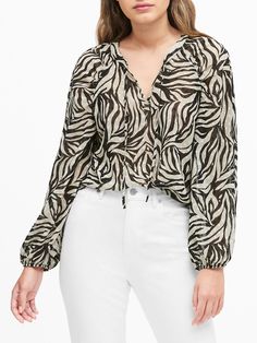 A delicate row of ruching creates a ruffled effect at the neckline of this silky soft, split-neck top.  Split neck with tie.  Elastic cuffs.  Shirttail hem.  Semi-fitted.  Long sleeves.  Hits at the hip.  Body length (size S): Regular 25" Sleeve length from center back: Regular 31" Model: Size XS, 5'10" (178cm).