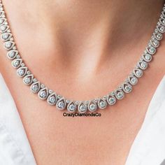 4mm Round Cut Moissanite Diamond Necklace, Pretty Tennis Necklace, 14k White Gold Designer Customised Wedding Necklace, Anniversary Gift  ✹✹𝐖𝐞𝐥𝐜𝐨𝐦𝐞 𝐭𝐨 𝐂𝐫𝐚𝐳𝐲𝐃𝐢𝐚𝐦𝐨𝐧𝐝𝐬𝐂𝐨✹✹ Detail about stones Moissanite & Simulated Stone: ----------------------------- Stone Shape: Round Cut Stone Size: 4.50 mm, 2.50 mm, 1.50 mm  Weight: 61.50 TCW (Approx.) Color: Colorless Cut: Excellent Clarity: VVS ★ 𝑰𝒕𝒆𝒎 𝑫𝒆𝒕𝒂𝒊𝒍𝒔:- ☛ Metal Purity: Solid Gold (10KT, 14KT, 18KT); Silver(925 Sterling, 935 Argentium), 950 Platinum ☛ Metal Tone: Yellow, White, Rose ☛ Stamp/Hallmark: Yes ★ 𝑪𝒖𝒔𝒕𝒐𝒎𝒊𝒛𝒂𝒕𝒊𝒐𝒏:- ☛ Customized Design Jewelry. ☛ All cuts which you dream to make with moissanite. ☛ Updating every step of your ordered jewelry(Loose Stone, CAD & Making Process) ☛ All listed items Luxury White Gold Bridal Necklace For Anniversary, Round Bridal Necklace Fine Jewelry, Luxury Round Bridal Necklace For Anniversary, Luxury Bridal Necklace For Anniversary, Exquisite Diamond Necklace For Anniversary, Oval Diamond Bridal Necklace For Formal Occasions, Anniversary Diamond Necklace With Round Cut Halo, Round Cut Diamond Necklace With Halo Setting For Anniversary, Formal Oval Diamond Bridal Necklace