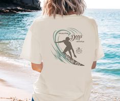 This T-shirt features a surfer riding a wave with scripture about God being with us even in troubled times. Perfect for beach lovers and surf enthusiasts, this garment-dyed tee is ideal for casual wear or as a statement piece for those who embrace the beach lifestyle and love Jesus! PRODUCT INFO Comfort Colors 1717 UNISEX relaxed fit,100% ring-spun cotton T-shirt, soft-washed, garment-dyed fabric, double-needle stitching, no side seams.   Your graphic will be printed direct to garment (DTG). This means that the ink will be embedded into the fabric itself and last much longer than a heat transfer image as well as be much softer to the touch.   SIZING Please refer to the sizing chart to find your perfect fit. For an oversized look, please go up 2 or 3x your normal size according to your need Beach Scripture, Summer Graphic Tee, Custom Made Shirts, About God, Troubled Times, Love Jesus, Beach Quotes, Beach Lifestyle, Ocean Lover