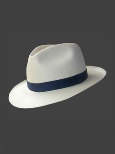 Brand: Gamboa PremiumColor: Natural Material: Toquilla Straw Brim: 7 - 7.5 cm. (2.76"- 2.96")Grade: 35 (Fine Fine)learn more Sweatband: Cotton Twill, 3 cm. (1.18") Crown: 10.37 - 10.87 cm. (4.1" - 4.3") Ribbon: Linen Description: A luxurious hat, handmade in Montecristi, the worldwide famous Panama Hat town in Ecuador. This Panama Fedora (Tuis) hat for men is a top quality, classic and elegant hat. Each hat is individually blocked and trimmed to meet the highest quality standards.Each Gamboa Pre Cuban Hat, Female Dreads, Poncho Mexican, Panama Hat Men, Poncho Pullover, Tailored Fashion, Hat Fedora, Alpaca Scarf, Elegant Hats