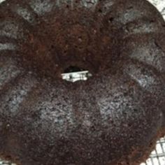 a chocolate cake sitting on top of a cooling rack