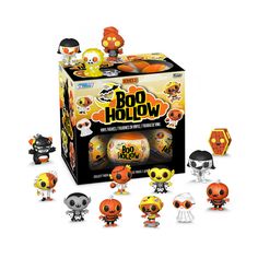 an assortment of halloween pop - up figures in front of a box with the contents