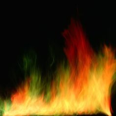 a fire is shown in the dark with red and yellow flames coming out of it