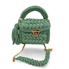 Luxury Crochet Bag - Capri Knit Sage Green Shoulder Bag - Handmade Boho Designer Tote, Elegant Artisanal Crossbody Bag Introducing our luxurious Capri Knit Sage Green Crochet Bag, a perfect blend of elegance and practicality. This handmade boho shoulder bag is meticulously crafted to bring a unique touch of sophistication to your style. Its serene sage green color and intricate knit pattern make it an eye-catching accessory for any occasion, whether it's a casual outing or a special event. Features: Material: Premium quality yarn in a calming sage green color Dimensions: Approx. 9x8x4 Inches - 23 (L) x 20 (H) x10 (W) Cm Strap Length: Adjustable for shoulder or crossbody wear Closure: Secure magnetic snap Design: Hand-knitted with detailed craftsmanship and vibrant patterns Usage: Perfect f Woolen Bag, Woolen Crochet, Tas Bahu, Handmade Crochet Bags, Mode Crochet, Crochet Shoulder Bag, Crochet Purse Patterns, Handbag Patterns, Luxury Purses