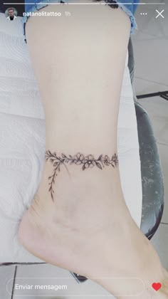 a woman's foot with a tattoo on it