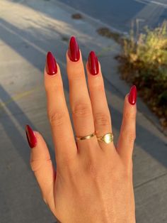 Sultry Red Nails, Red Almond Nails Medium Length, Red Almond Nails Aesthetic, Wine Red French Tip Nails Almond, Nail Colors For Darker Skin Tones, Blood Red Almond Nails, Red Summer Acrylic Nails, Shimmery Red Nails, Red Acrilycs Nails