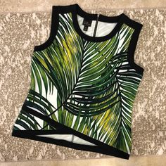 Worthington Dress Top. Functional Zipper On Back. Print: Green/White Paradise 93% Polyester, 7% Spandex Sleeveless Tropical Print Tank Top For Spring, Spring Tropical Print Sleeveless Tank Top, Sleeveless Tank Top With Tropical Print For Spring, Green Sleeveless Tops With Tropical Print, White Floral Blouse, Sleeveless Tunic Tops, Petite Blouses, White Button Down Shirt, Silky Blouse