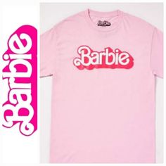 N.W.T. Barbie The Movie Logo T Shirt Be Ready To Party Like Barbie Any Time In This Fun Pink T Shirt! This Official Barbie The Movie Graphic Tee Is The Perfect Way To Show Off Your Fandom And Is Sure To Be Popular Wherever You Wear It! Officially Licensed Exclusively At Spencer's Length: About 29" From Shoulder To Hem Crewneck Short Sleeves Material: Cotton Care: Machine Wash; Tumble Dry Low This Shirt Is Unisex Sizing Only For A Fitted Look, Order One Size Smaller Than Your Normal Size **Be Sur Pink Fun Top With Text Print, Pink Slogan Crew Neck Shirt, Pink Slogan Shirt With Crew Neck, Pink Crew Neck Shirt With Slogan, Fun Logo Print Tops For Streetwear, Fun Pink Shirt With Text Print, Fun Logo Print Summer Tops, Fun Streetwear Tops With Logo Print, Pink Cotton T-shirt With Logo