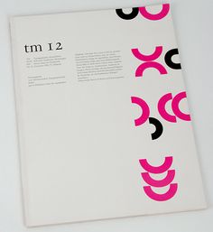 the back side of a magazine with pink and black designs on it's cover