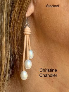 "This is a classic pair of pearl and leather dangling earrings that can be worn with anything.  There is a choice of 2 styles \"A-Frame\" or \"Stacked\".  There are 3 white freshwater rice style 10mm pearls on each earring.  The earrings dangle 2.5 inches.  You can order in any leather color.  Sterling Silver ear wires." Leather Teardrop Jewelry, Elegant Teardrop Leather Jewelry, Elegant Leather Earrings As Gift, Elegant Leather Earrings For Gift, Elegant Leather Earrings Perfect For Gifts, Elegant Leather Earrings With Ear Wire, Elegant Leather Dangle Jewelry, Elegant Leather Dangle Earrings, Adjustable Dangle Pearl Earrings With Pearl Charm