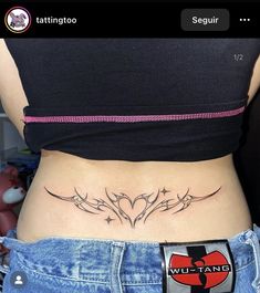 a woman with a tattoo on her stomach