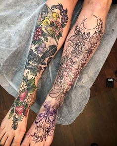 two people with tattoos on their legs and one is holding the other's leg