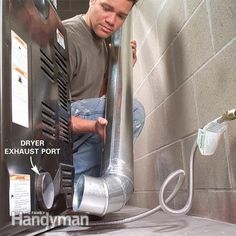 a man is working on an industrial blow dryer