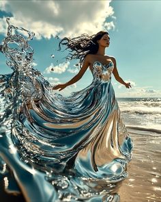 a woman in a flowing dress on the beach