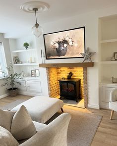 a living room filled with furniture and a fire place