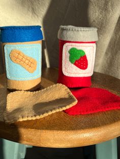 two cups on a wooden table with one cup in the middle