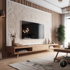 a living room with a large flat screen tv on the wall and wooden flooring