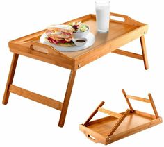 a wooden tray with a sandwich and drink on it