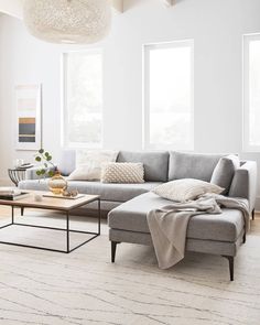 a living room filled with furniture and white walls