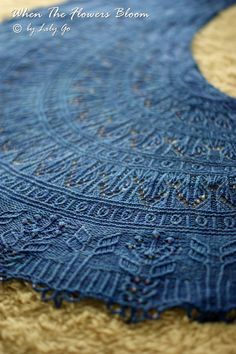 a blue piece of cloth sitting on top of a rug