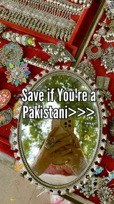 someone taking a selfie with their cell phone in front of a mirror that says save if you're a pakistan