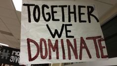 a sign that says together we dominate