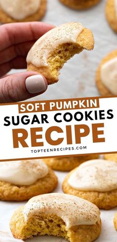 soft pumpkin sugar cookies with white frosting on top are being held up by a hand