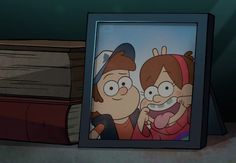 an image of two cartoon characters in front of a photo frame on a shelf next to a bookshelf