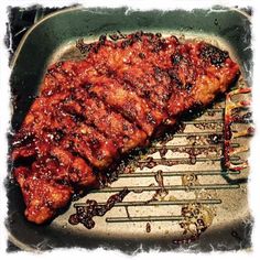 the meat is being grilled and ready to be cooked in the grilling pan