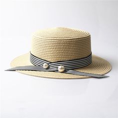 This absolutely perfect straw hat is the perfect compliment to any summer and spring outfit. This gorgeous woven pattern and color accessorize your look perfectly with a fabulous silk black or striped ribbon. Come in nine fabulous colors and styles. Adjustable Striped Straw Hat For Vacation, Striped Sun Hat For Spring Vacation, Adjustable Striped Spring Hats, Spring Adjustable Striped Hats, Spring Striped Straw Hat, Spring Striped Adjustable Hats, Adjustable Striped Hats For Spring, Elegant Spring Straw Sun Hat, Striped Sun Hat For Spring