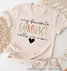 My Favorite Gymnast Calls Me Mom Shirt, Gymnastics Mom T-Shirt, Gymnastics Shirt, Gymnast Sweatshirt, Gymnastics Biggest Fan, Gymnastics Mom #GymnasticsShirt, #GymnasticsTeam, #GymnasticsCoach, #GymnasticsGift, #GymnastShirt, #GymnastGift, #GymnastTee, #MatchingGymnastTee, #GymnasticsFanShirt, #GymnasticsMom, #TumblingShirt, #GiftForCoach, #LoveOfGymnastics Gymnastics Quotes, Gymnastics Mom, Mommy Outfits, Gymnastics Outfits, Comfort Colors Sweatshirt, Mama T Shirt, Call My Mom, Sports Tees