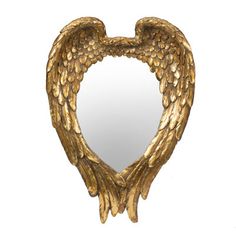 a gold heart shaped mirror with wings on it