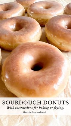 doughnuts with instructions for baking or frying on parchment paper, in front of a white background