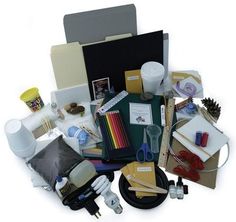 an assortment of crafting supplies including scissors, tape, pencils and other items