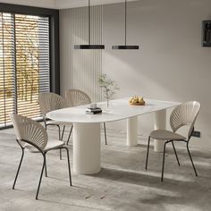 a white table with four chairs around it