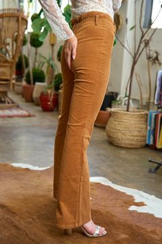 Add iconic '70s style to your look with high-rise, full-length flare pants detailed with patch pockets and a button fly.Material: 98% cotton 2% spandex Stretch: Slightly stretchy Care: Machine wash cold, gentle cycle, tumble dry low. Imported Corduroy Flare Pants, Stylish Pants, Black Camel, Corduroy Fabric, Flower Child, Corduroy Pants, Flare Pants, Bell Bottoms, Fashion Pants