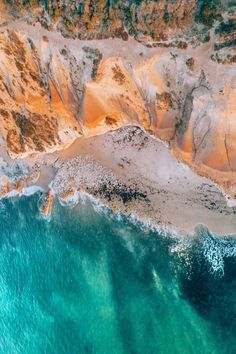 an aerial view of the ocean and land