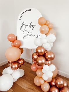 there is a sign that says baby shower and balloons