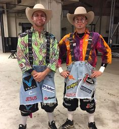 two men in cowboy hats and overalls standing next to each other with patches on them