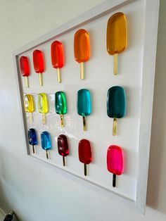 an ice cream popsicle display on a white wall