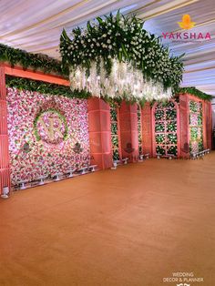 an indoor wedding setup with flowers and greenery