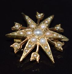 An early Edwardian or late Victorian pearl 9ct gold brooch, set in gold with natural pearls 2.2cms wide and 3.8gms. Elegant Star-shaped Brooch Jewelry, Elegant Star-shaped Jewelry Brooch, Elegant Star-shaped Brooch, Formal Star-shaped Brooch Jewelry, Vintage Star-shaped Brooches For Formal Occasions, Elegant Star-shaped Brooch For Gift, Elegant Star-shaped Wedding Brooch, Vintage Star Brooches For Formal Occasion, Elegant Star-shaped Brooches For Gifts