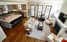 an aerial view of a living room and kitchen