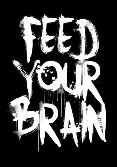 the words feed your brain written in white ink on a black background with dripping paint