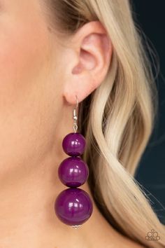 Oversized purple beads gradually increase in size as they drip from the ear, coalescing into a colorful statement piece. Earring attaches to a standard fishhook fitting.

Sold as one pair of earrings. Turquoise Stone Jewelry, Paparazzi Accessories Jewelry, Purple Beads, Material World, Purple Earrings, Statement Drop Earrings, Fish Hook Earrings, Paparazzi Accessories, The Ear