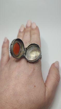 Impressive antique arabic islamic gemstone carnelian and sterling pill snuff box ring. A true statement piece locket ring set with a large carved carnelian set to the front. In good condition with time patina It is Unmarked and tests as 800 silver, c1910s. Weight 20 grams Inside diameter  18 mm  All of our pieces are in pre-loved, vintage or antique condition, with signs of age and wear preserved as a mark of authenticity. Large Gemstone Rings, Locket Ring, Victorian Ring, Carnelian Agate, Sterling Silver Locket, Silver Locket, Box Ring, Victorian Rings, Please And Thank You