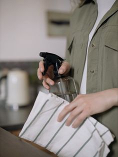 a person holding a bag and an object in their hand