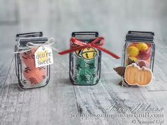 three mason jars filled with different types of candy