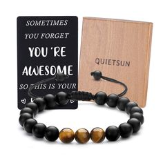 a bracelet and book with the words you're awesome written on it, sitting next to each other